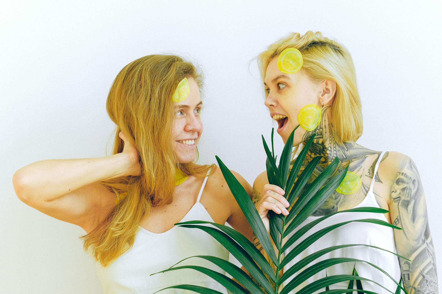 Two women smiling together with joy, representing comfort and connection in new relationships